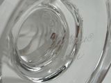 a close up of a clear glass vase on a table