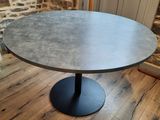 round dining table with black pedestal base