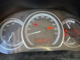 a close up of a car ' s dashboard with a speedometer