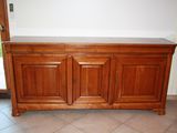 an image of a wooden cabinet in a living room