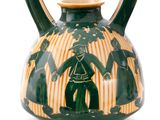 a green and yellow vase with a man and woman on it