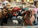 many different types of elephant figurines sitting on a table