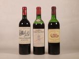 trois bouteilles de vin posées l'une à côté de l'autre sur une table