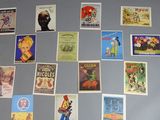 a refrigerator covered with many different posters on the wall