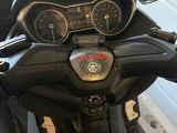 a close up of a motorcycle with a speedometer and gauges