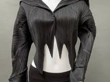 an image of a mannequin wearing a black top and skirt