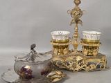 two cups and a saucer sitting on a table