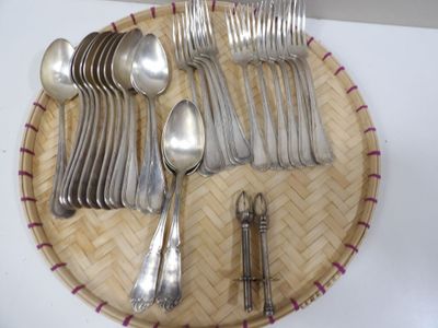 a lot of silver spoons and spoons on a plate