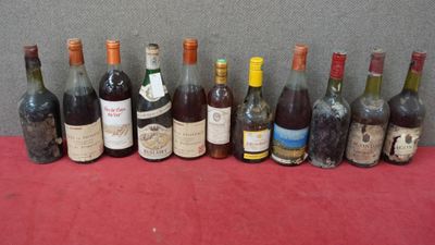 several bottles of wine are lined up on a table