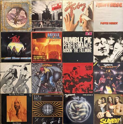various album covers on a wall in a room