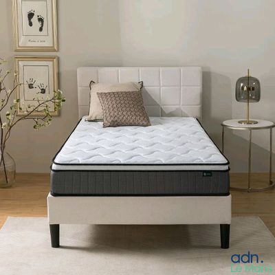a picture of a mattress in a bedroom with a pillow on it