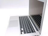 a close up of a laptop computer on a white surface