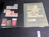a book with stamps on it sitting on a table