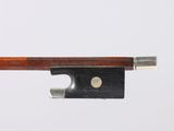 a close up of a violin bow on a white background