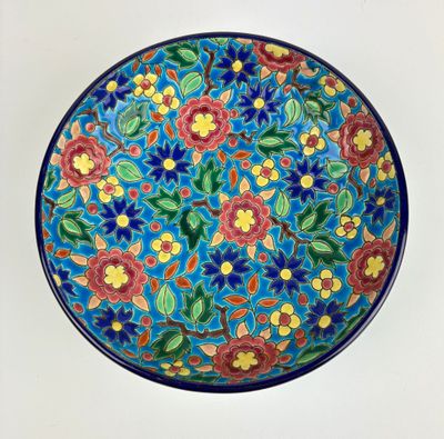 an image of a colorful plate with flowers painted on it