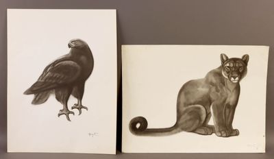 deux tableaux représentant un chat et un oiseau posés sur une table