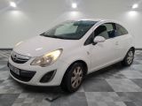 a picture of a small white car parked in a garage
