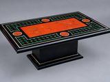 a black table with orange and green inlays on it