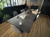 a long table with chairs in the middle of a room