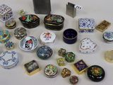 many different types of decorative boxes on the table