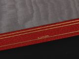 an image of a red book with gold trim