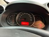 a close up of a dashboard with a speedometer and gauges