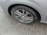 a close up of a car ' s tire on the road