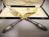 two forks and a knife in a case
