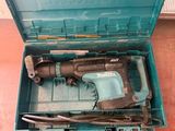 a blue tool box with a hammer and a hammer in it