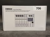 the box for the dm06x digital mixer sits on the floor