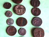 some old coins are arranged in a circle on a green surface