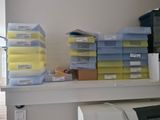 a lot of boxes on a shelf in a room