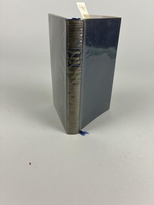the book is open on a white surface with a blue stripe