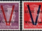 a stamp with three different stamps on it and one with a v on it