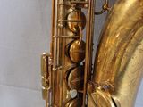 a gold saxophone that is sitting on a table