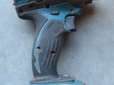 a cordless drill that is sitting on the floor