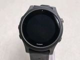 a smart watch that is sitting on top of a stand