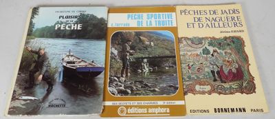 three books on a table with pictures of people in boats