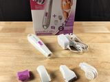 a box with a hair dryer and other items on a table
