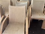 a lot of chairs that are sitting in front of a blackboard