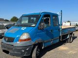 a blue truck that is parked in the parking lot