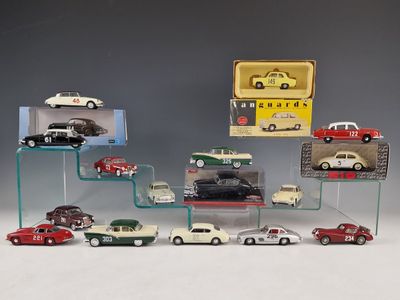 a display of various model cars on a glass shelf