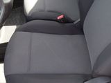 the seats of a car are black and grey in color