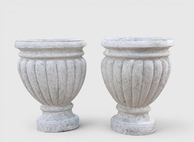 pair of white stone urns on a white background