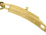 an image of a close up of a gold bracelet on a white background