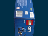 a blue box with a lego figure inside of it