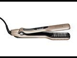 a close up of a hair straightener on a white background