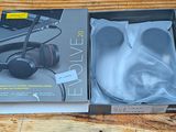 packaging of a pair of headphones sitting on top of a wooden table