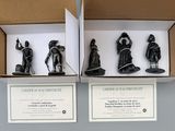 two boxes that have some figurines in them