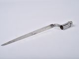 a small knife that is laying on a white surface